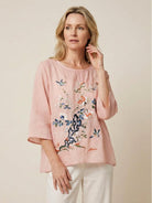 100% cotton linen hand-embroidered shirt with 3/4 flare sleeves and asymmetric hem