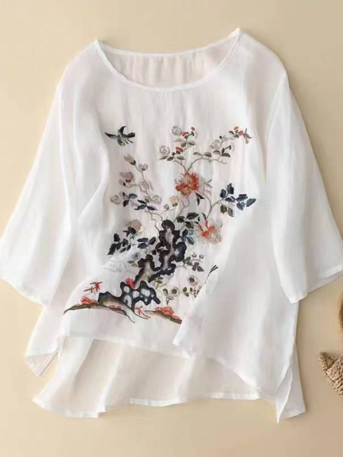 Hand-embroidered cotton-linen shirt with 3/4 flared sleeves and asymmetric hem