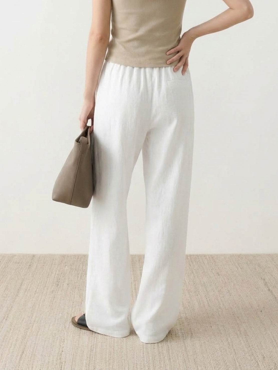 High-rise wide-leg 100% linen pants with elastic waistband and side pockets