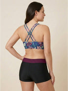 Three-piece tankini set with criss-cross back design including tank top, sports bra, and boy shorts