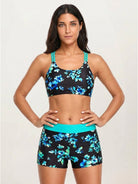 Three-piece tankini set with criss-cross back design and printed sports bra and boy shorts