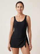 Ruched wrap one-piece swimdress with adjustable straps and built-in shorts for coverage and comfort