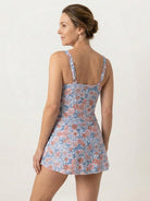 Ruched wrap one-piece swimdress with adjustable straps and tie-front skirt in matte fabric