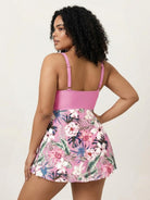 One-piece tropical crossover skirted swimsuit with deep-V solid top and floral high-waist bottom
