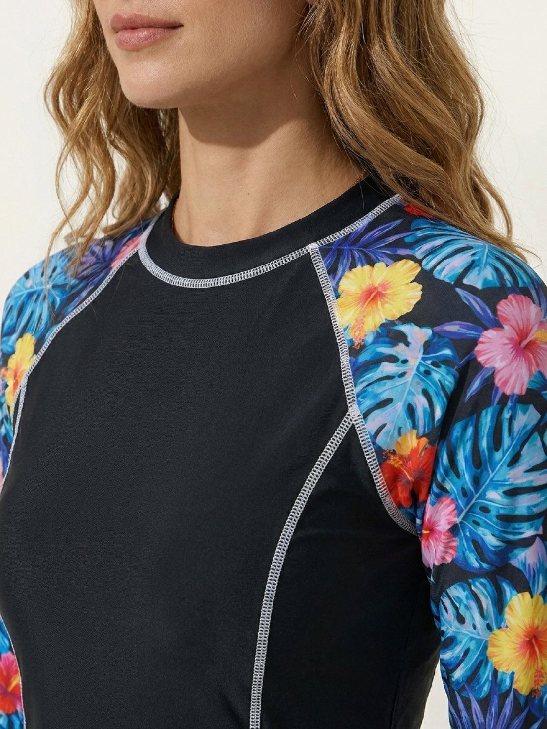 Long-sleeve UV rash guard set with tropical print sleeves and matching swim shorts for sun protection and water activities