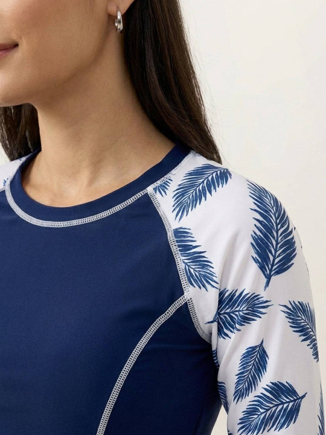 Long-sleeve UV rash guard set with tropical print sleeves and matching swim shorts