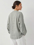 Oversized linen-cotton tang knot blouse with batwing sleeves and elasticated cuffs