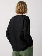 Oversized 100% linen blouse with traditional frog-button closure and curved hem in lightweight fabric