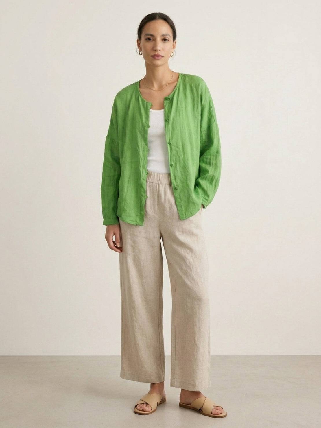 Oversized 100% linen blouse with traditional frog-button closure and curved hem