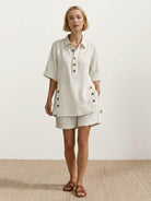 100% cotton beige oversized button-front co-ord set with relaxed shorts and decorative side buttons