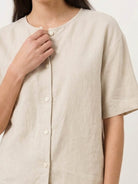 100% cotton two-piece set with button-front top and wide-leg pants in soft solid colors