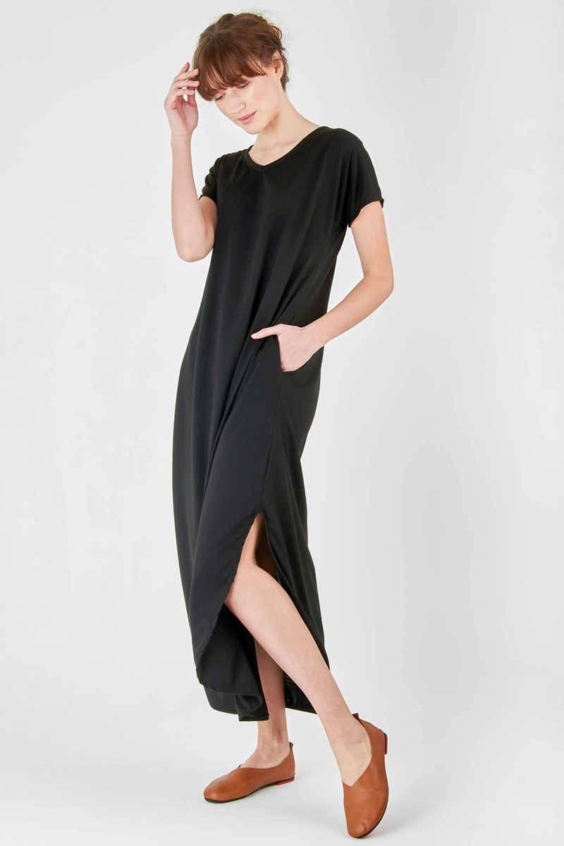 Black side slit maxi dress with pockets, V-neck, rolled sleeves, and relaxed fit.