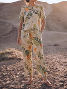 woman wearing relaxed cotton linen set with short sleeves and straight-leg pants in monochrome tones