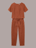 Woman wearing 100% cotton linen monochrome co-ord set with relaxed short-sleeve top and straight-leg pants
