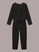 Model wearing cotton-linen monochrome relaxed longline top and wide-leg pants set