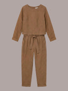 woman wearing cotton-linen monochrome relaxed longline top and wide-leg pants set