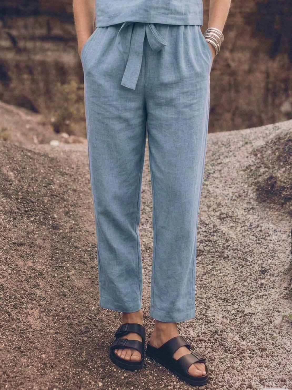 Woman wearing cotton-linen monochrome relaxed longline top and wide-leg pants set