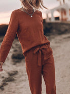 Model wearing a relaxed cotton-linen monochrome capsule outfit with longline top and wide-leg pants