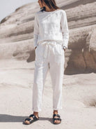 woman wearing cotton-linen monochrome relaxed longline top and wide-leg pants set