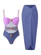 Gold-detail cutout one-piece swimsuit with ruched panels and midi wrap skirt on white background