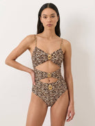 Gold-detail cutout one-piece swimsuit with ruched panels and midi wrap skirt beachwear set