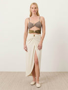 Gold-detail cutout one-piece swimsuit with ruched panels and midi wrap skirt beachwear set