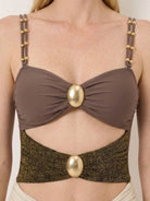 Gold-detail cutout one-piece swimsuit with ruched panels and midi wrap skirt on white background