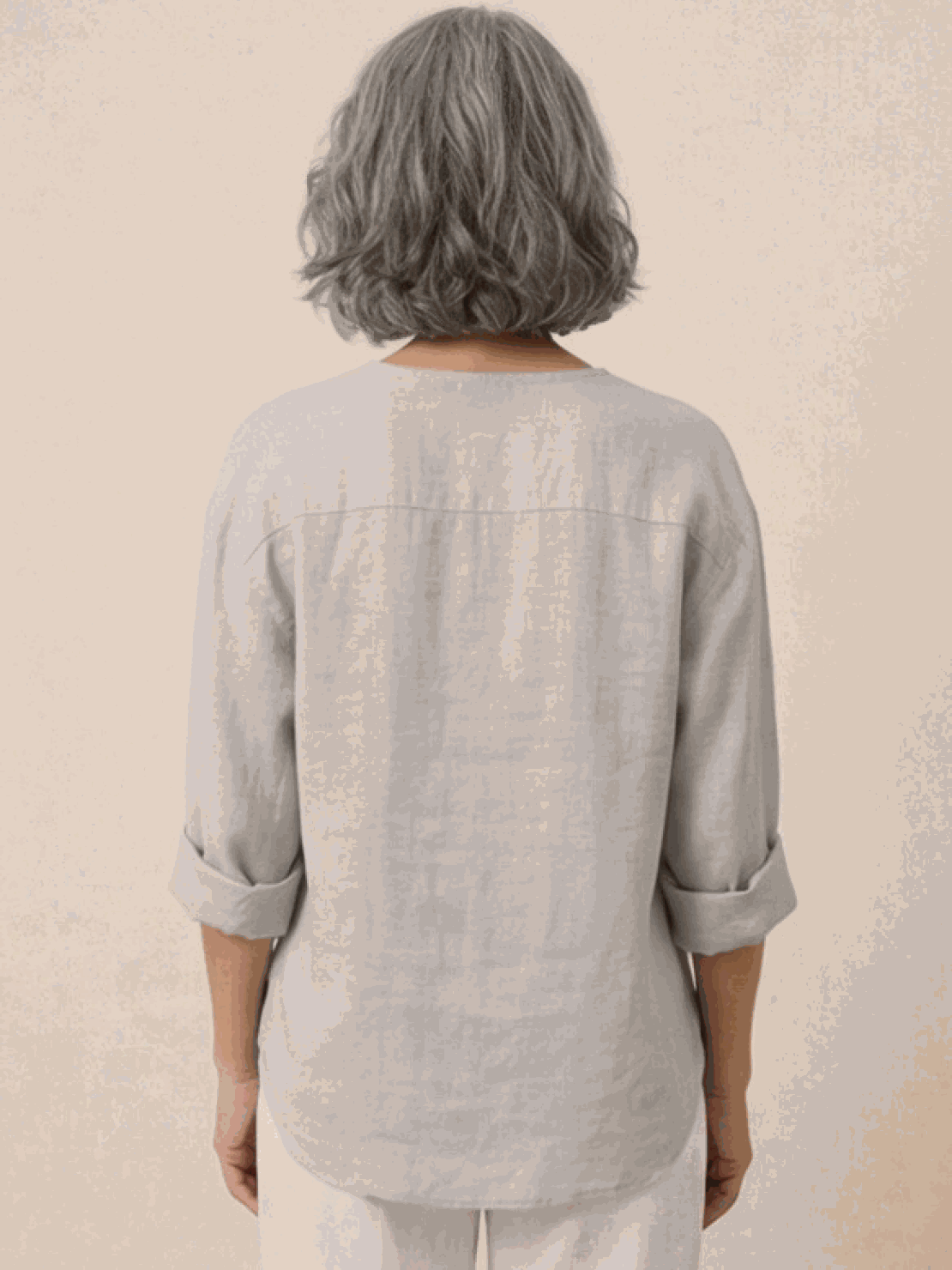 White pure linen age-defying button detail shirt displayed on a mannequin