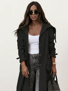Minimalist hooded coat with oversized fit and lightweight fabric for travel and layering