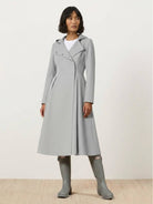 Women wearing water-repellent A-line hooded raincoat with belt outdoors