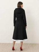 Elegant women's water-repellent A-line hooded raincoat with belted waist and insulated lining