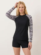 Women's swim shorts rash guard set with long raglan sleeves and matching mid-rise boyshorts in stretch fabric