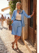 Woman wearing a stylish blazer and high-waisted shorts two-piece set in a polished, coordinated look