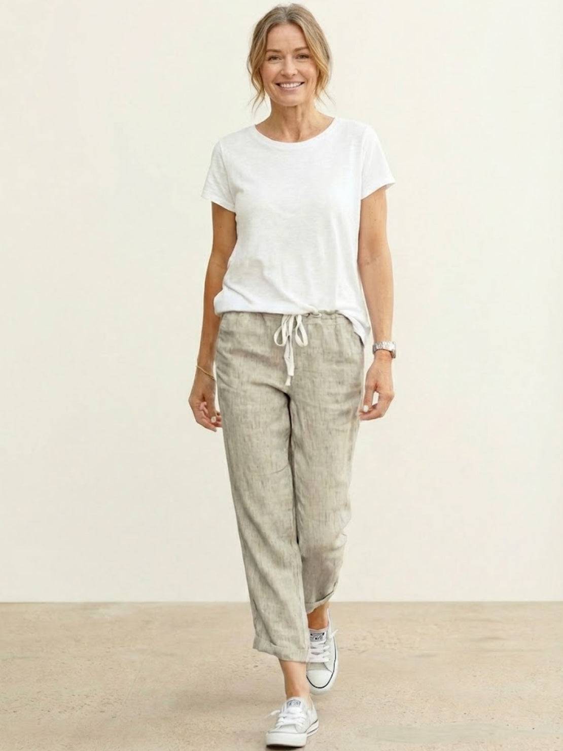 Woman wearing breezy relaxed fit straight pants in casual stylish setting