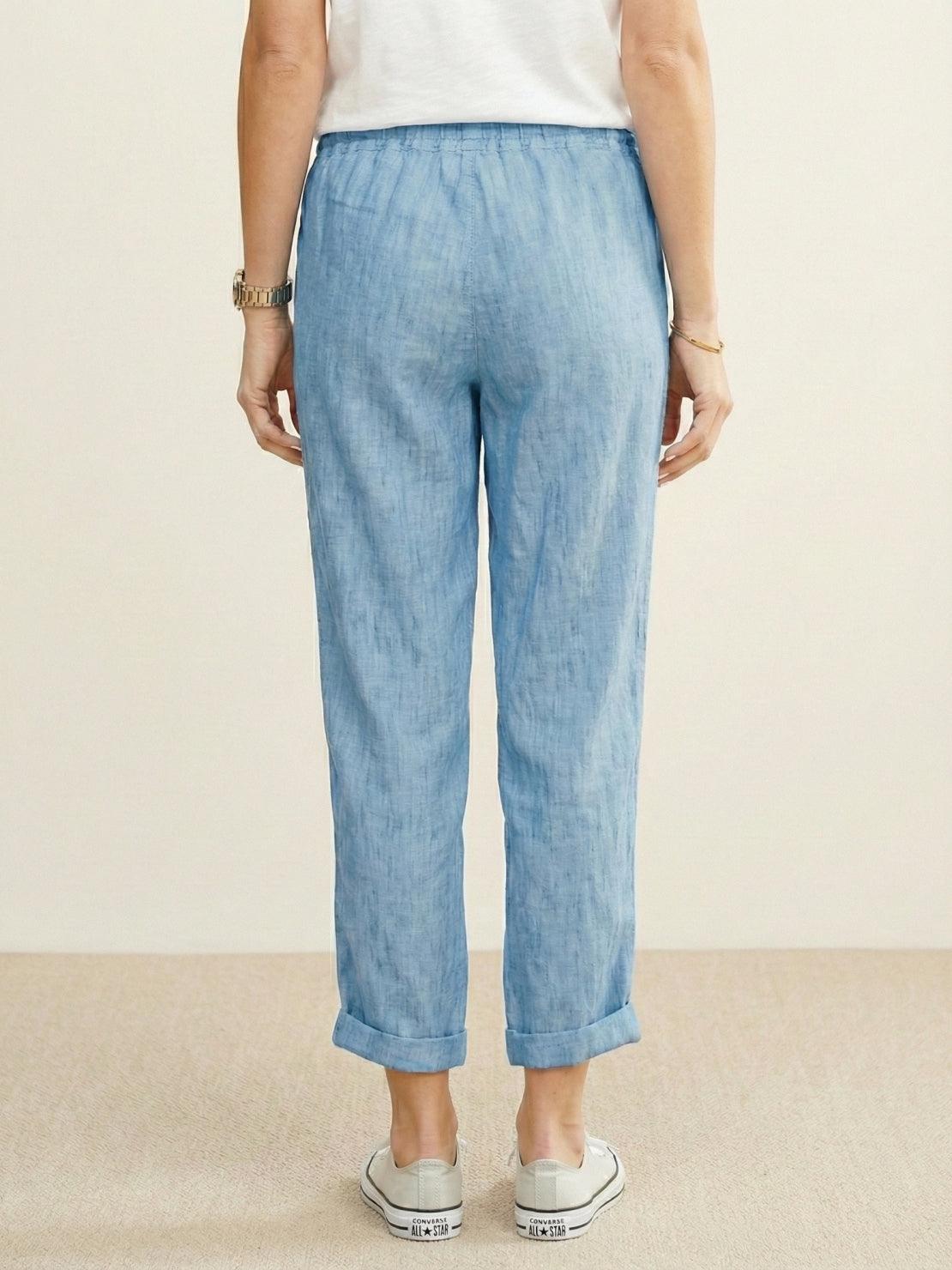 Woman wearing breezy relaxed fit straight pants, showcasing supreme comfort and stylish casual look