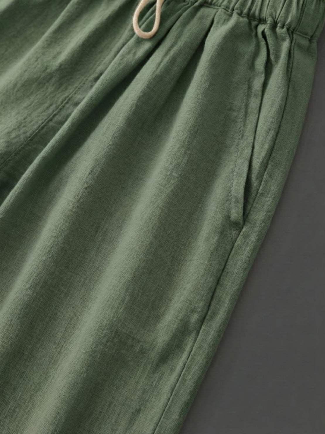 Woman wearing breezy relaxed fit straight pants in orange and black, styled for casual and chic looks