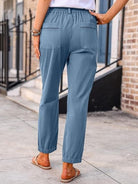 Casual button-down utility-chic trousers featuring deep pockets and soft durable cotton blend fabric