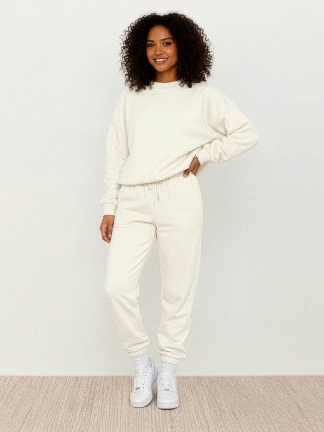 Woman wearing Classic Comfort Athleisure set in neutral tones, showcasing stretchy, flattering, wrinkle-resistant fabric for all-day comfort and versatile style