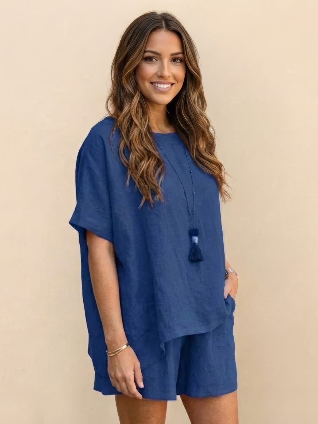 Woman wearing a comfy linen-like shirt and shorts two-piece set in light fabric for casual and versatile style