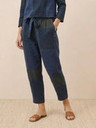 Model wearing relaxed cotton-linen monochrome longline top and wide-leg pants set