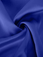 Woman wearing Elegant Layers Two-Piece Set with V-neck layered top and matching pants, styled for versatile comfort and flattering fit