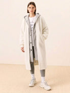 Woman wearing white everyday wear oversized sherpa long coat with cozy lining and relaxed fit