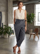 High-waist wrapped pants in breathable stretch fabric with unique wrap design and one-side pocket for all-day comfort and style