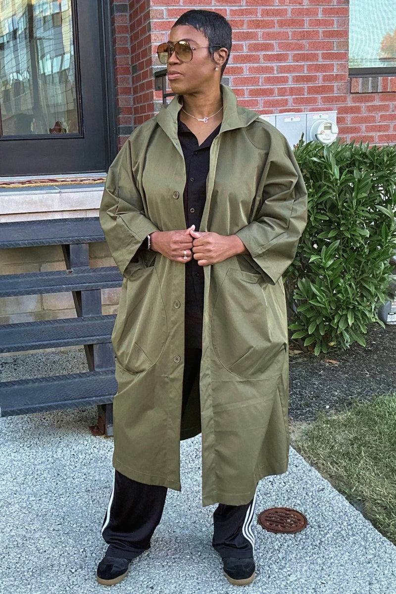 Oversized one-size Heritage Windbreaker Jacket in olive green, water-resistant lightweight coat with snap buttons and spacious pockets.