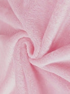 Close-up of soft pink plush faux fur fabric for open front oversized fur jacket texture
