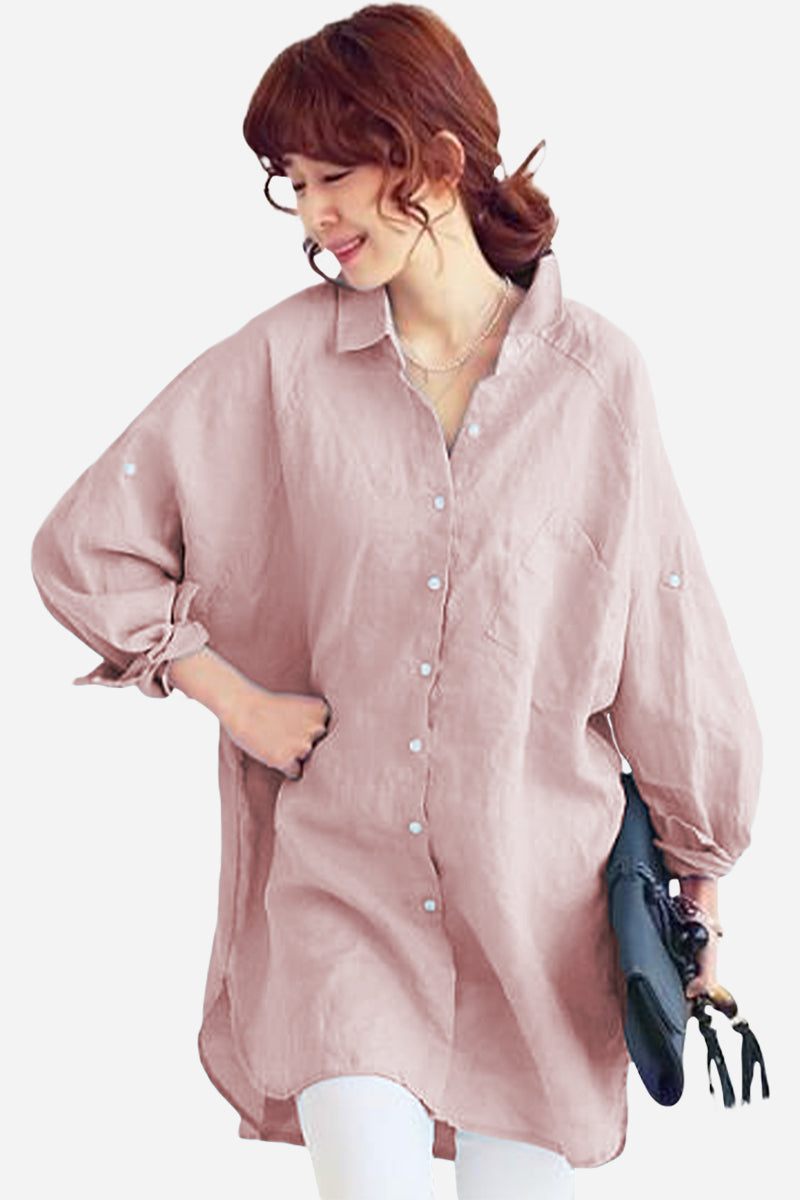 Woman wearing oversized linen shirt in sun-washed pink with relaxed fit and rolled sleeves