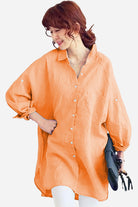Oversized linen shirt in sun-washed pink with relaxed fit and button details