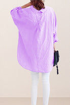 Back view of oversized linen shirt in light purple with relaxed fit and button detailing