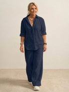 Woman wearing oversized 100 cotton shirt with wide-leg pants co-ord set in navy blue