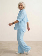 Model wearing oversized 100% cotton shirt with wide-leg pants co-ord set in relaxed fit